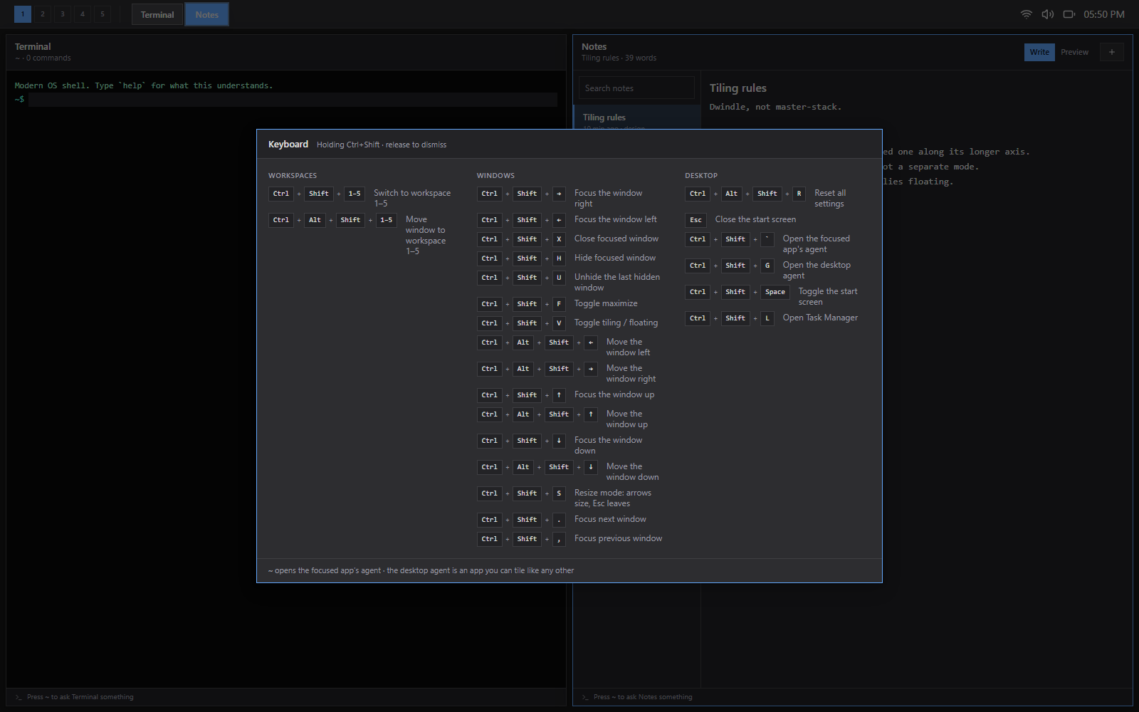 The hold-to-remember cheatsheet showing three columns of bindings grouped into Workspaces, Windows and Desktop